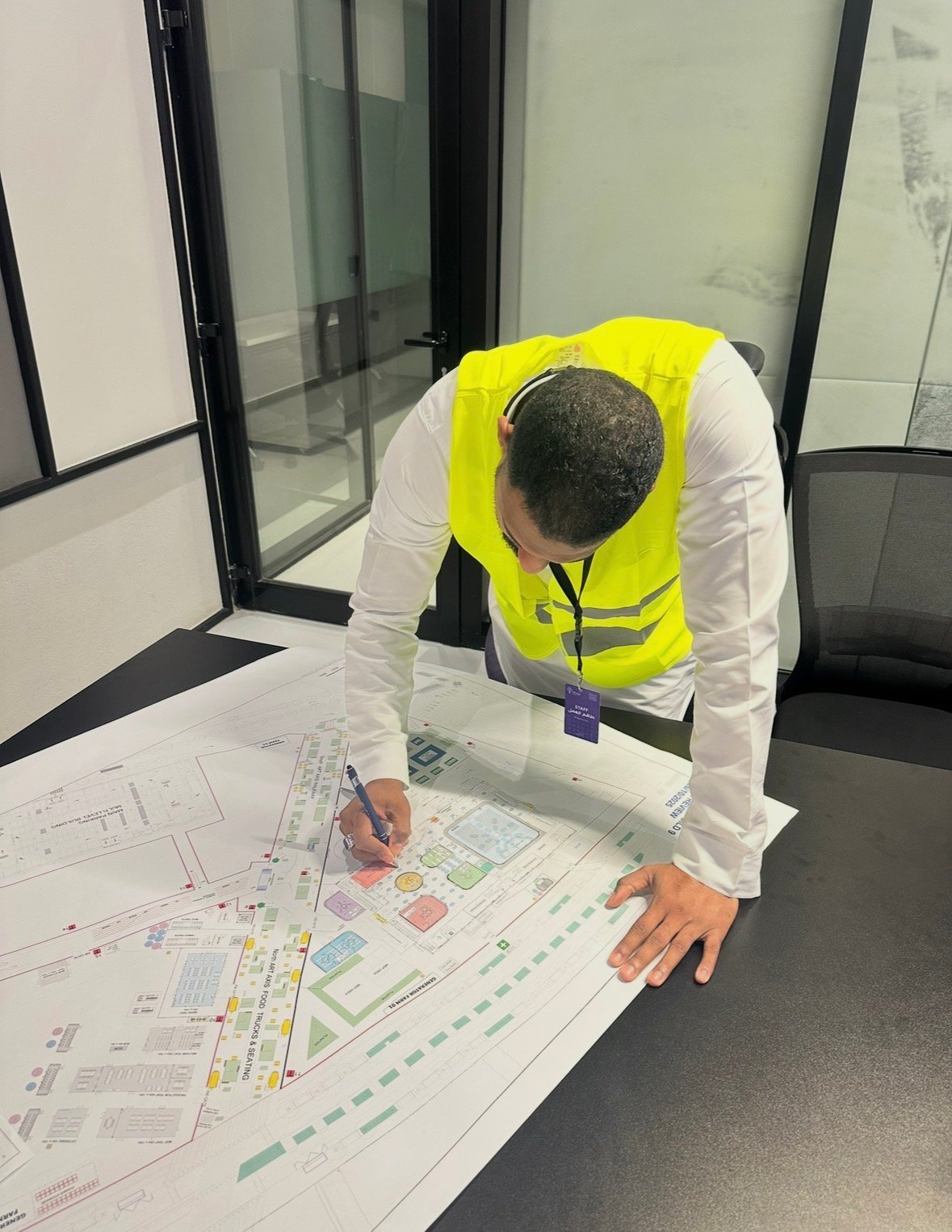 Amgad Fadl reviewing the operational area map during Misk Global Forum
